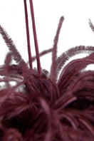Elegant burgundy red feather long gown by MANITO, featuring soft silk fabric and flowing design for formal occasions.