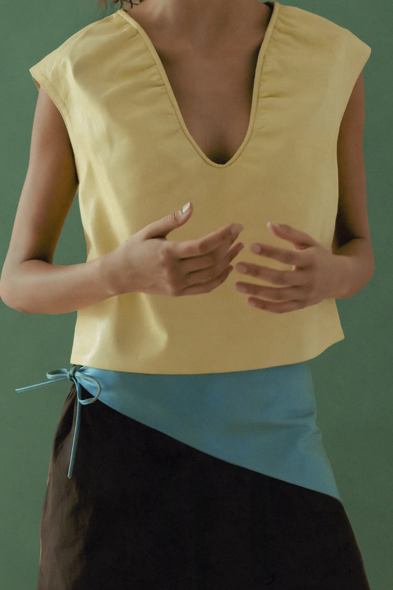 Double A Fiona leather top in butter yellow, featuring a stylish fitted design and smooth leather texture.