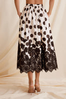 Scarlett Gasque Fiorella dotted midi skirt shown from the back with a flowy fabric and mid-length design.