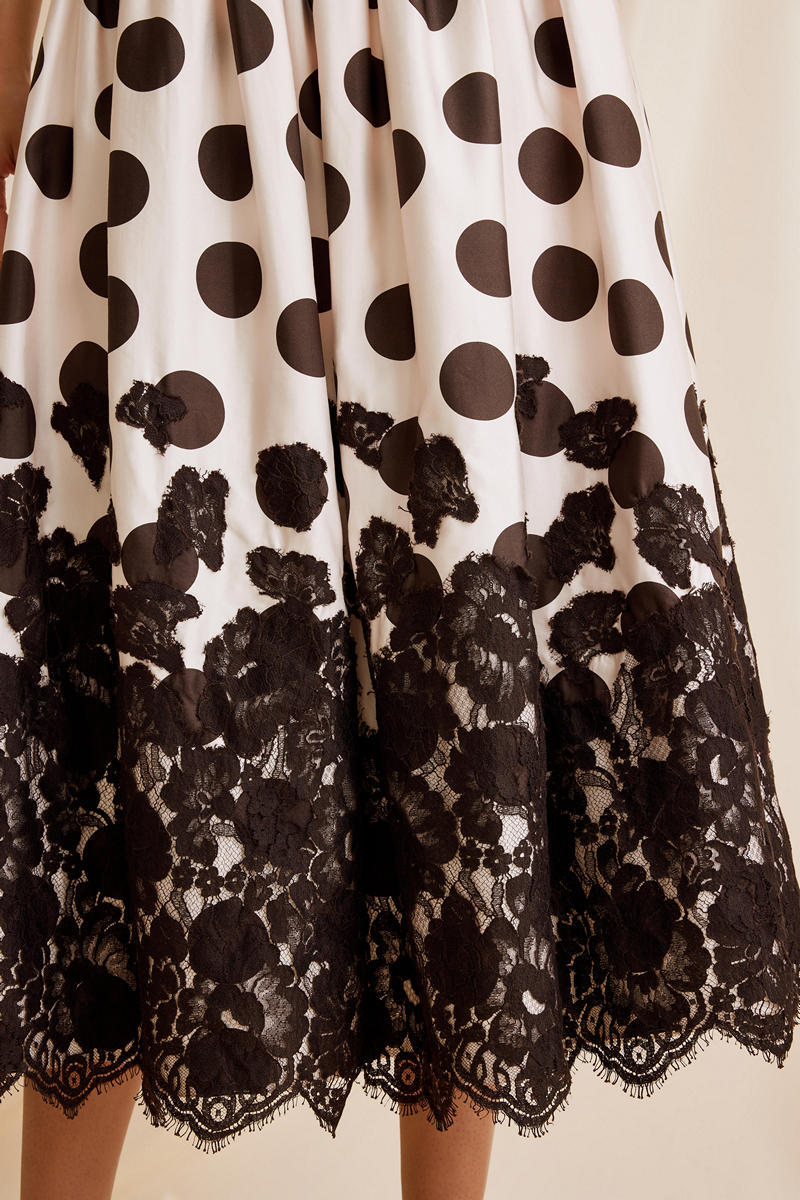 Scarlett Gasque Fiorella dot midi skirt featuring a flowing fabric and stylish polka dot pattern.