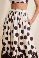 Scarlett Gasque Fiorella Dot Midi Skirt featuring a flowy fabric with a dotted pattern and a stylish, feminine silhouette.
