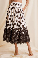 Scarlett Gasque Fiorella Dot Midi Skirt displayed from the front, featuring a stylish polka dot pattern and a flowy silhouette.