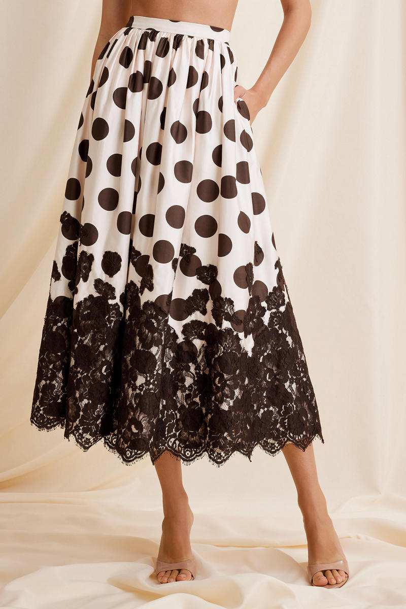 Scarlett Gasque Fiorella Dot Midi Skirt displayed from the front, featuring a stylish polka dot pattern and a flowy silhouette.