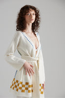 First Born Knits LA PALME cardigan in soft fabric, featuring a cozy, stylish design perfect for layering.