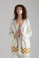 First Born Knits LA PALME cardigan in soft knit fabric, featuring a cozy design with a button-up front and ribbed details.