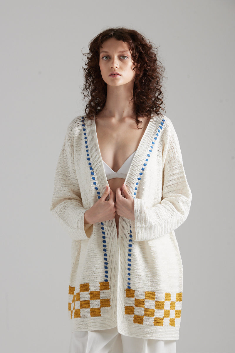 First Born Knits LA PALME cardigan in soft knit fabric, featuring a cozy design with a button-up front and ribbed details.