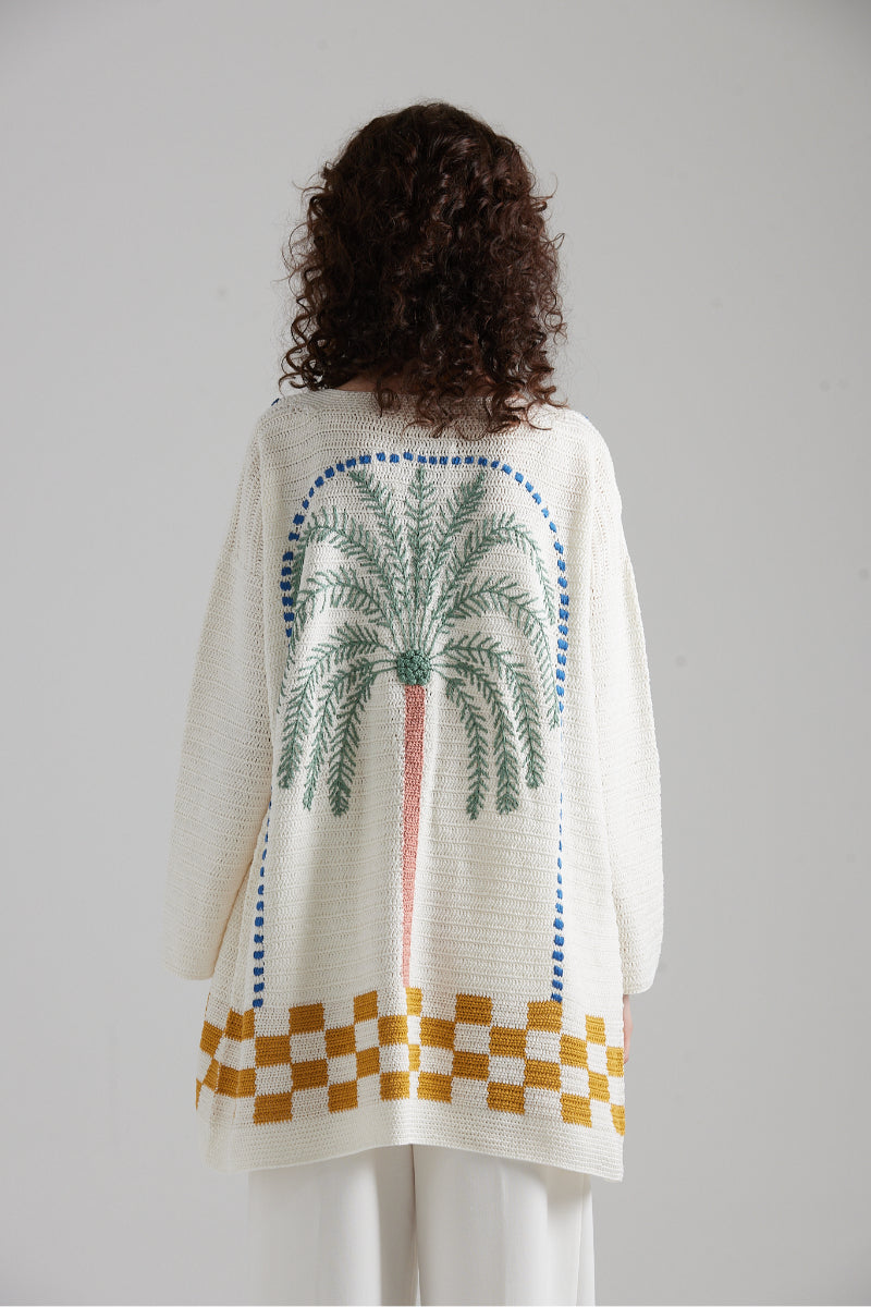 First Born Knits LA PALME cardigan in soft knit, featuring a cozy, stylish design and natural color.