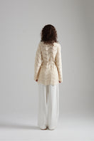 Light beige MIA cardigan by First Born Knits, featuring a cozy knitted texture and a relaxed fit.