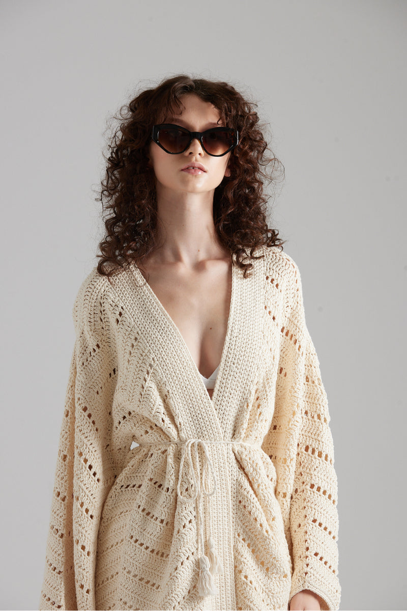 Light beige MIA cardigan by First Born Knits, featuring a soft knit texture and button-front design.