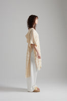 First Born Knits EL PONCHO KNIT top featuring cozy knit fabric and stylish design, worn by a model showcasing its fit and texture.