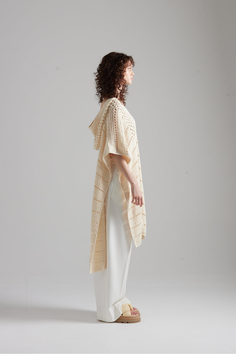 First Born Knits EL PONCHO KNIT top featuring cozy knit fabric and stylish design, worn by a model showcasing its fit and texture.