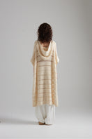 First Born Knits EL PONCHO KNIT top featuring a cozy, textured knit fabric in a stylish poncho design.