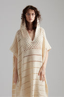 First Born Knits EL PONCHO KNIT top featuring a cozy, textured knit fabric in a stylish poncho design.