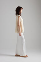 First Born Knits Amelie Knit top featuring a cozy, textured design, showcased on a neutral background.