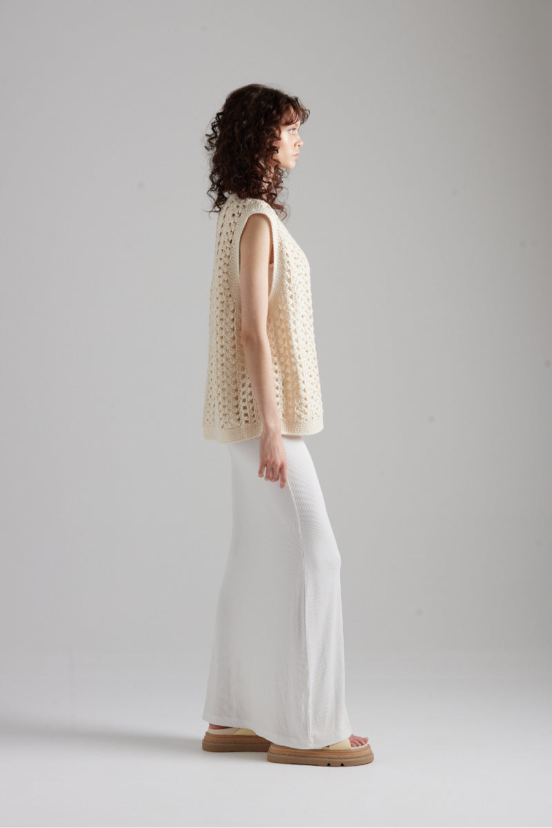First Born Knits Amelie Knit top featuring a cozy, textured design, showcased on a neutral background.
