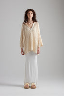First Born Knits CELINE polo top, fitted with classic collar and short sleeves, displayed on a neutral background.