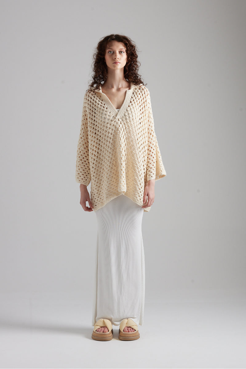 First Born Knits CELINE polo top, fitted with classic collar and short sleeves, displayed on a neutral background.