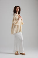 First Born Knits CELINE polo top, sleek design with classic collar and short sleeves, displayed on a neutral background.