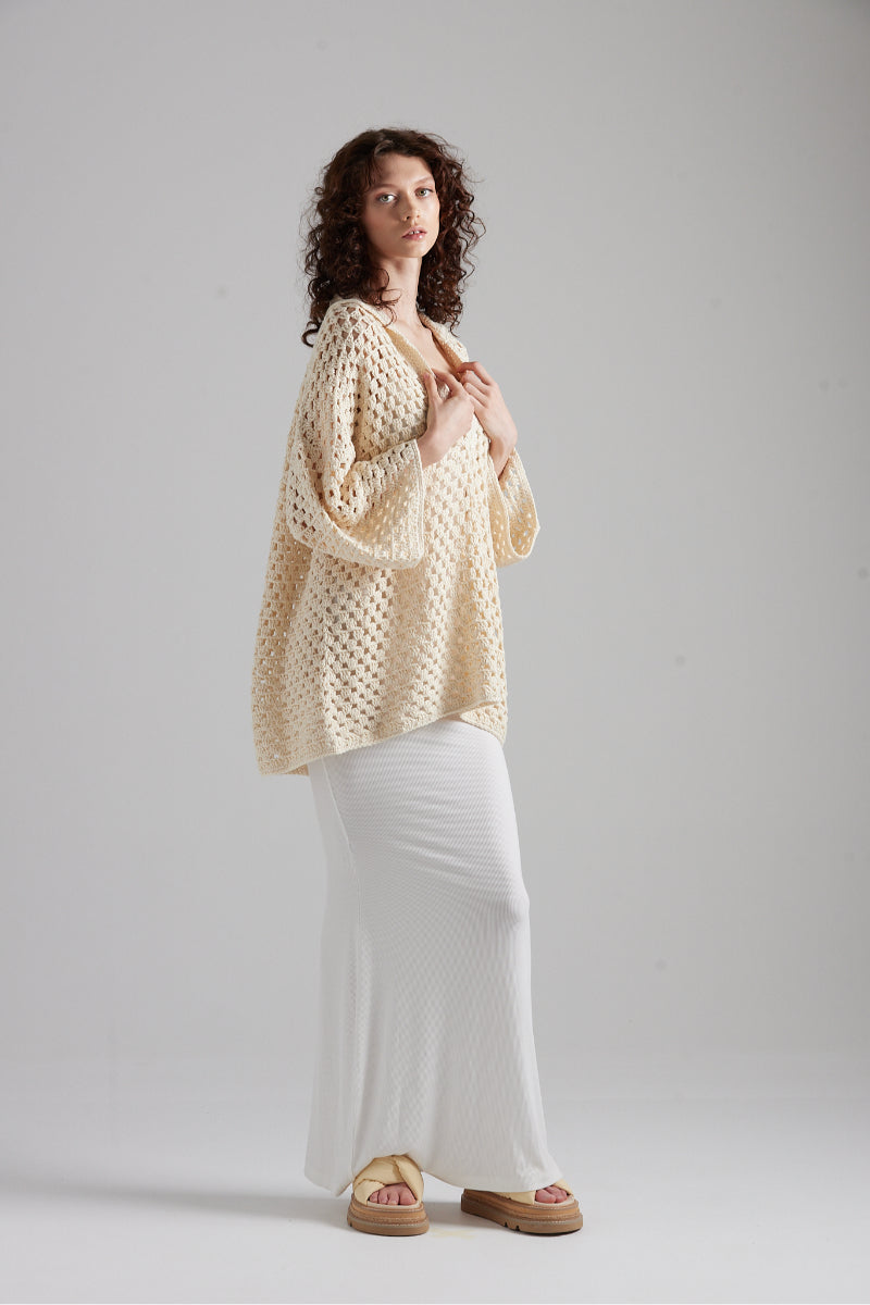First Born Knits CELINE polo top, sleek design with classic collar and short sleeves, displayed on a neutral background.