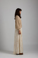 Light beige LULU cardigan by First Born Knits, featuring a cozy knit design and button-up front, perfect for casual wear.