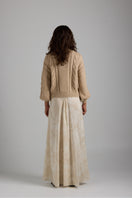 Cream-colored Lulu cardigan by First Born Knits, featuring soft knit fabric and a cozy, relaxed fit.