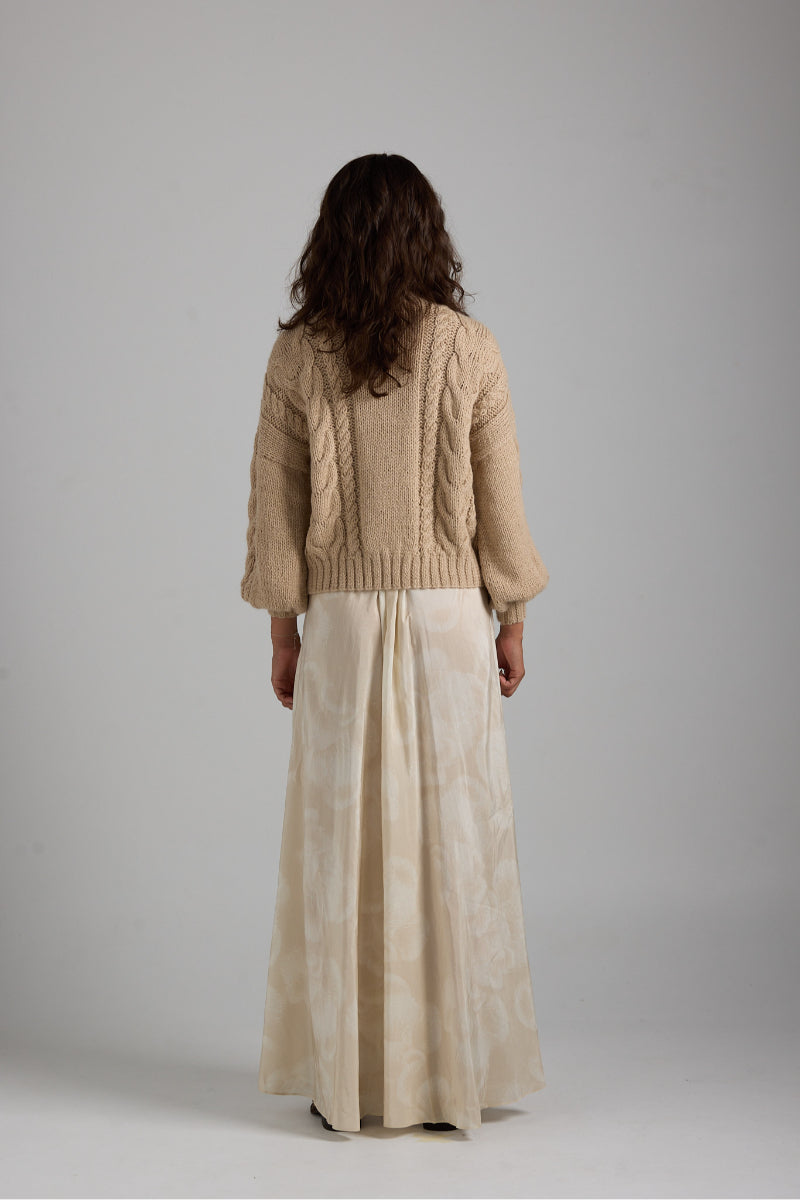 Cream-colored Lulu cardigan by First Born Knits, featuring soft knit fabric and a cozy, relaxed fit.