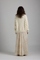 Light gray Paris cardigan by First Born Knits, featuring soft knit fabric and a classic button-up design.