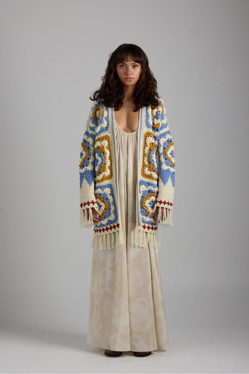 Light gray Sienna cardigan by First Born Knits, featuring a cozy knit texture and a classic button-up design.