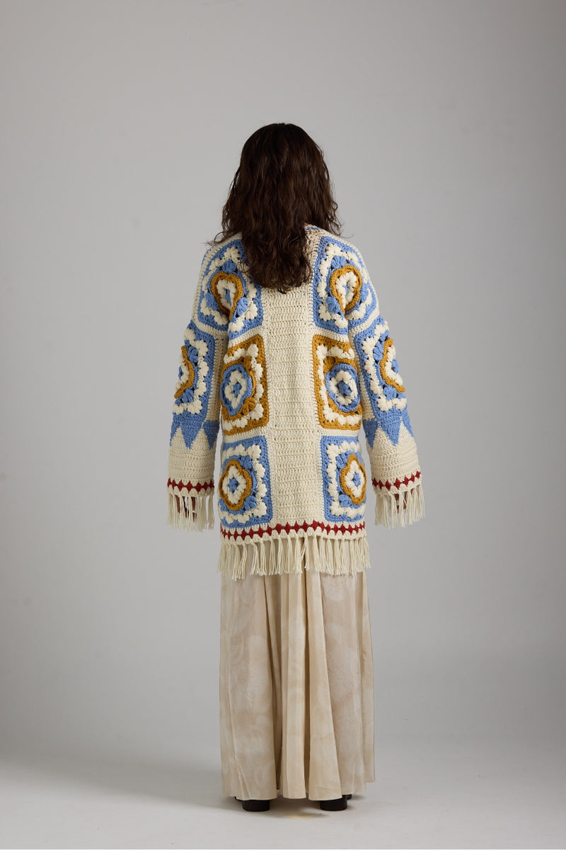 Light beige Sienna cardigan by First Born Knits, featuring a cozy knit texture and button-up front.