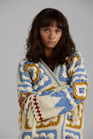 Light beige Sienna cardigan by First Born Knits, featuring a cozy knit texture and button-front design.