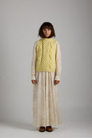 First Born Knits Tierra Vest in cozy knitwear style, showcasing a textured, earthy-toned vest with ribbed details.