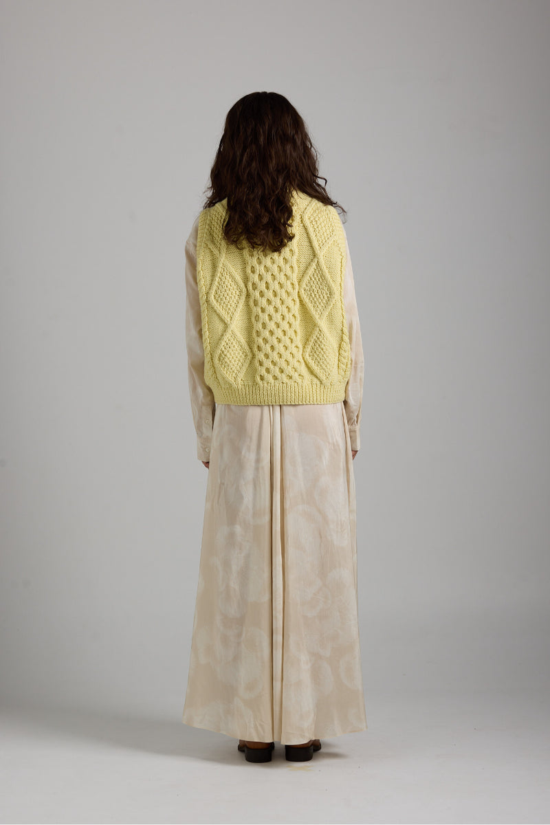 Cozy Tierra Vest from First Born Knits, a stylish knitwear piece featuring a textured design and neutral color.