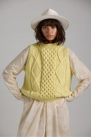 First Born Knits Tierra Vest, a cozy knitwear piece in earthy tones, displayed on a neutral background.