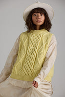 Cream-colored Tierra Vest knitwear by First Born Knits, featuring a cozy, textured design perfect for layered winter style.