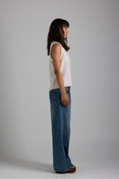 White Chloe vest from First Born Knits, a stylish knit top featuring a cozy, modern design in soft white yarn.