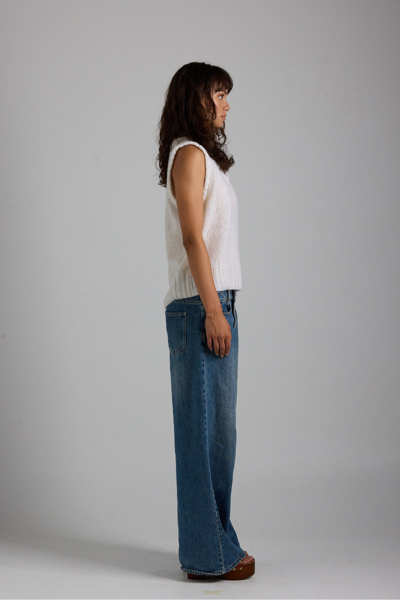 White Chloe vest from First Born Knits, a stylish knit top featuring a cozy, modern design in soft white yarn.