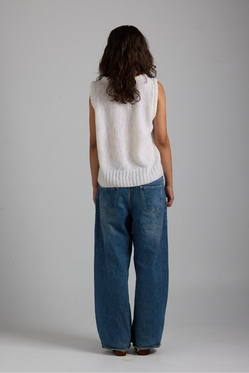 White Chloe knit vest by First Born Knits, featuring a cozy, stylish top with a textured knit pattern.