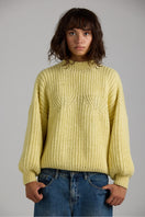 Cream-colored shell sweater from First Born Knits, featuring a cozy knit texture and classic design.
