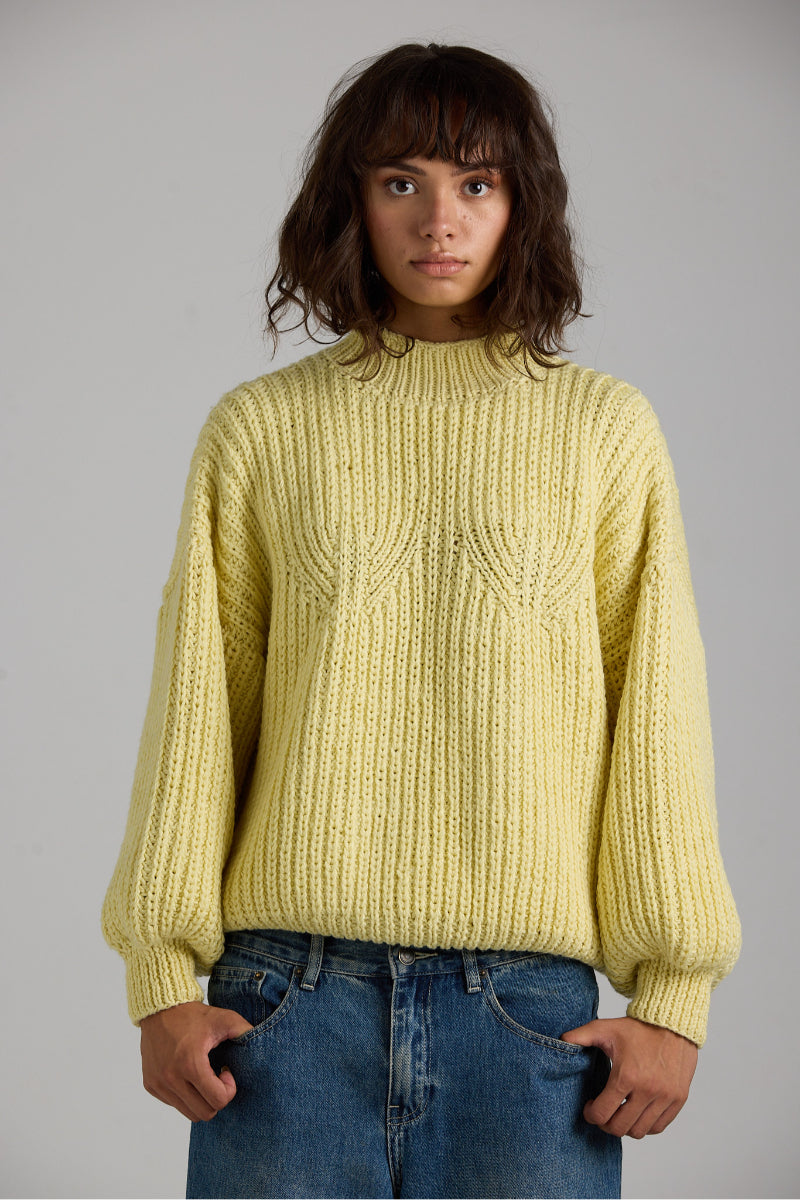 Cream-colored shell sweater from First Born Knits, featuring a cozy knit texture and classic design.