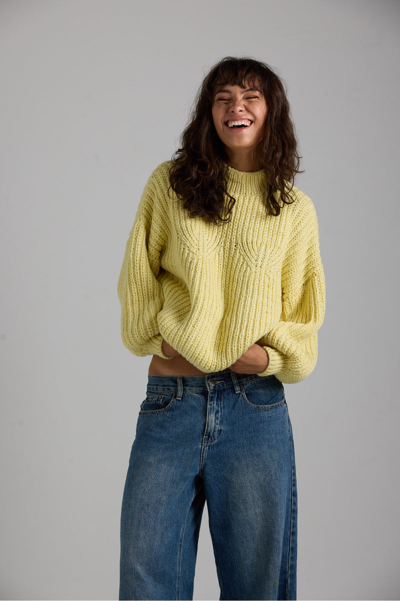 Cream-colored Shell Sweater by First Born Knits, featuring a cozy knitted design and relaxed fit.