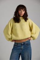 Cream shell sweater from First Born Knits featuring a cozy knit texture and classic fit.
