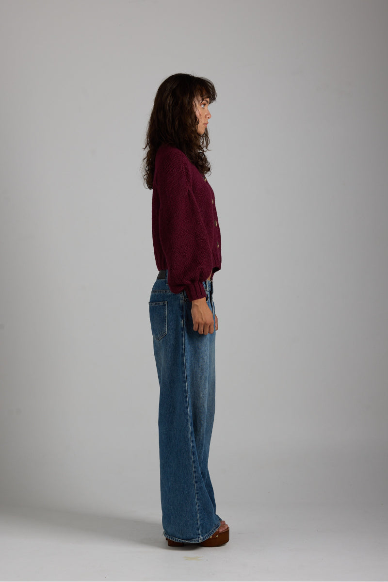 Soft beige Frenchie cardigan by First Born Knits, featuring a cozy knit texture and button closure.