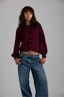 Light gray Frenchie cardigan by First Born Knits, featuring a cozy knit texture and a classic button-up design.