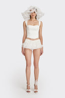 Off-white fitted corset bustier top by Stolen Stores, form-fitting with structured design and lace-up front detail.