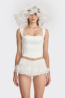 Off-white fitted corset bustier top by Stolen Stores, showcasing a structured, form-fitting design with lace-up details.