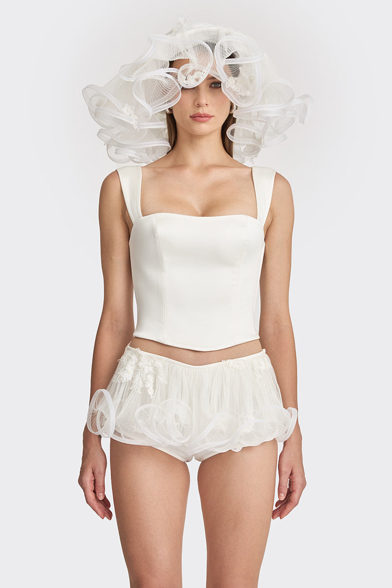 Off-white fitted corset bustier top by Stolen Stores, showcasing a structured, form-fitting design with lace-up details.