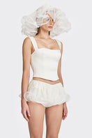 Off-white fitted corset bustier top by Stolen Stores, form-fitting with structured design and adjustable straps.