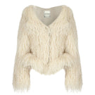 Beige fitted fur jacket by Tayfun Kaba, showcasing a stylish warm jacket with a tailored fit and plush fur details.