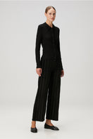 Black fitted rib button-down shirt by Bassigue, showing close-up of the tailored collar and fabric texture.