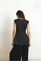 Black fixed corset top by YASSMIN SALEH, shown from the back with structured design and adjustable lacing detail.
